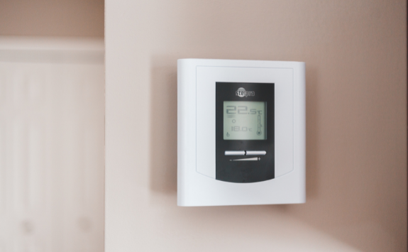 A thermostat on the wall